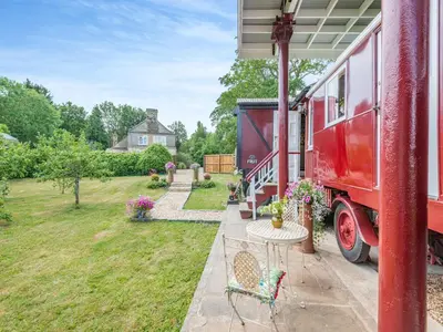 a red truck parked outside of a house at Mahalia in Fordham