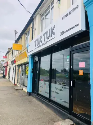 a row of store fronts on a street at AC Lounge 119a in Rochford