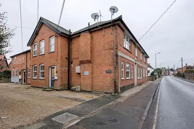 a brick building on the side of a street at 1 Abbey Mews, Leiston in Leiston
