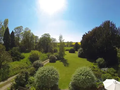 an overhead view of a garden with trees and bushes at The Old Rectory, Kettlebaston in Lavenham
