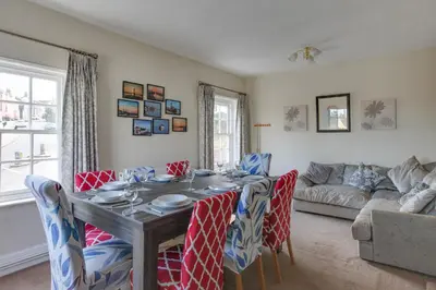 a dining room with a table and chairs at The Red House Maldon in Maldon