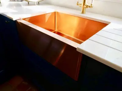 a bathroom sink with a copper counter top at Huge Luxury 8 Bed Manor House Hot Tub Pool Table in Saffron Walden