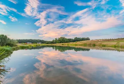 a view of a river with clouds in the sky at Woodbell Lodge in Chappel