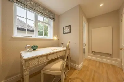 a home office with a desk and a window at The Farmhouse, Nether Hall Estate in Pakenham