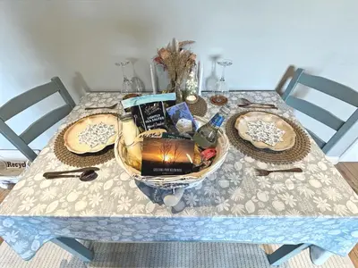 a table with a bowl of food on it at Willow Barn luxury countryside accommodation in Bury St Edmunds in Bury Saint Edmunds