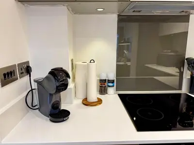a kitchen counter with a coffee maker on a counter top at Home2home - Mill Park in Cambridge