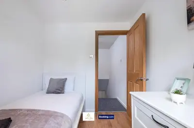 a bedroom with a bed and a mirror at Centrally Located 3 Bedroom House By Trinity Stays Short Lets & Serviced Accommodation Cambridge in Cambridge