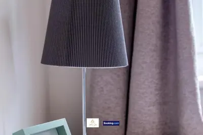 a lamp sitting on a table next to a window at Centrally Located 3 Bedroom House By Trinity Stays Short Lets & Serviced Accommodation Cambridge in Cambridge