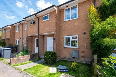 a brick apartment building with a yard at Centrally Located 3 Bedroom House By Trinity Stays Short Lets & Serviced Accommodation Cambridge in Cambridge