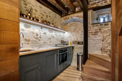 a kitchen with a sink and a counter top at Toll Barn, St Osyth Priory in Colchester