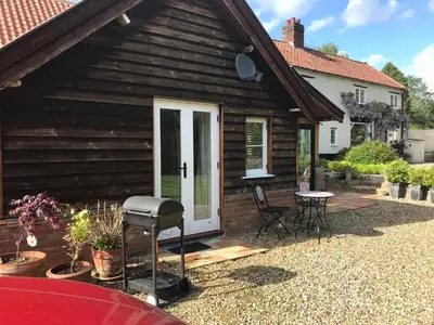 a barbecue grill in front of a house at Garden View in Saxlingham Thorpe