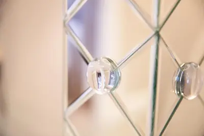 a close up of a glass door with a mirror at Velvet 2-bedroom apartment, Conduit Lane, Hoddesdon in Hoddesdon