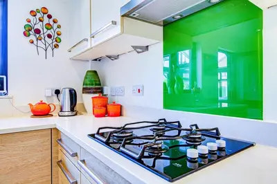 a kitchen with a stove top in a kitchen at Serene Family Escape - Spacious, Near Thorpe Bay and Southend, Beaches & Amenities - Pass the Keys in Southend-on-Sea
