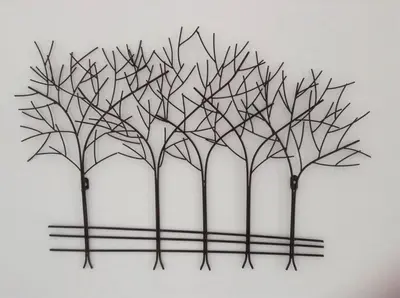 a metal picture of trees on a wall at The Old Dairy, Valley Farm, Middleton in Middleton
