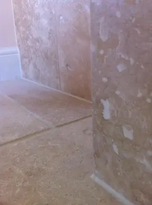 a corner of a room with a wall and a tile floor at Bridge Hotel Brandon in Brandon