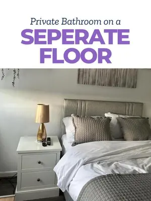 a bedroom with a white bed and a white nightstand at Isabella Rooms in Hockley
