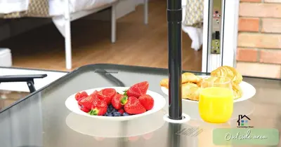 a bowl of fruit on a table with a plate of food at 4-5 Bedroom House Garden Lots of Parking 15 min to city Close to motorway in Girton