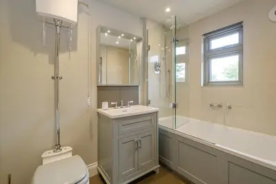 a bathroom with a toilet and a sink and a shower at Alde Bay Farm - Lobster Pot in Aldeburgh