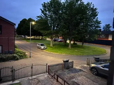 a street with a car parked on the road at Tree View Apartment in Chesterton