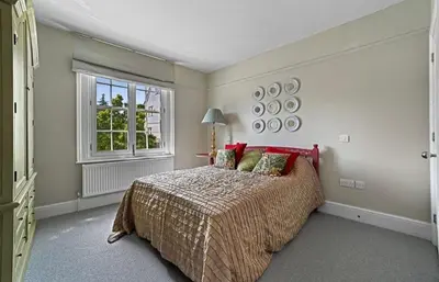 a bedroom with a large bed and a window at 119 Flat 2 Northgate st - Stylish one bedroom apartment set within walking distance to town, spacious living space with public car park close by in Bury Saint Edmunds