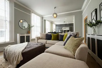 a living room with two couches and a couch at Stylish Central Apartment with Parking & Lift in Bury Saint Edmunds