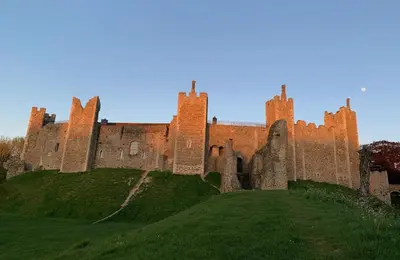 an old castle on top of a grassy hill at Waterpump Pod for 2 adults with ensuite in the Suffolk Countryside in Badingham