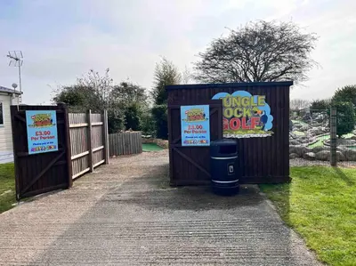 a couple of outhouses with signs on them at Lola’s Caravan. Your home away from home. in Parkeston