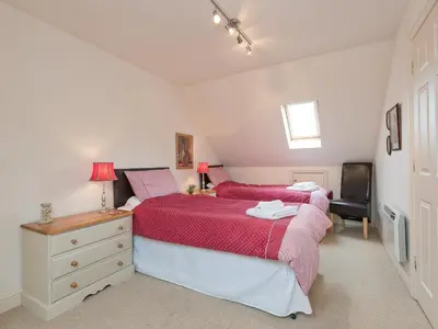 a bedroom with two beds and a desk and a television at Jubileum Lodge Uk27999 in Watton