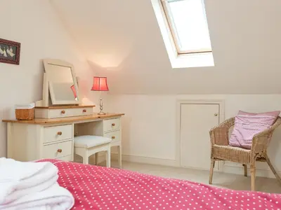 a bedroom with a bed and a desk and a mirror at Jubileum Lodge Uk27999 in Watton