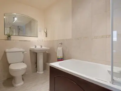 a bathroom with a toilet and a sink and a mirror at Jubileum Lodge Uk27999 in Watton
