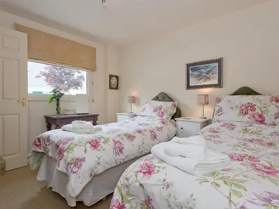 a bedroom with two beds and a window at Jubileum Lodge Uk27999 in Watton