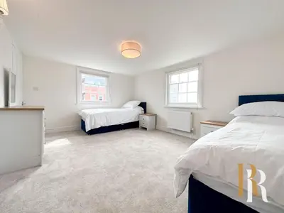 a white bedroom with two beds and two windows at Fisherman's Cottage - Harwich Breaks - BRAND NEW - long stays available great prices - get in touch for all bookings - cottage in harwich - beach stay in Harwich