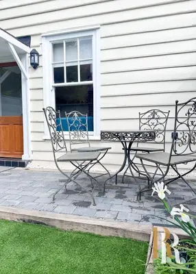 two chairs and a table in front of a house at Fisherman's Cottage - Harwich Breaks - BRAND NEW - long stays available great prices - get in touch for all bookings - cottage in harwich - beach stay in Harwich