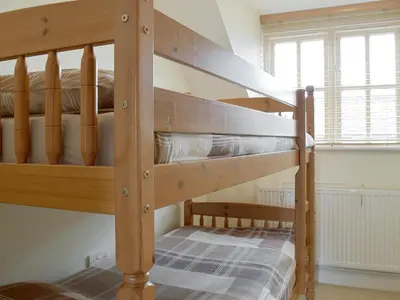 a couple of bunk beds in a room at Dormers in Leiston