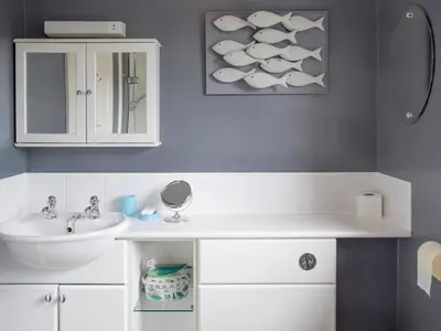 a bathroom with a sink and a mirror at Dormers in Leiston