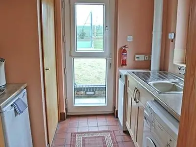 a kitchen with a sink and a window at The Lodge in Withersfield