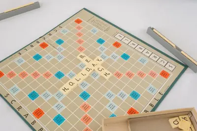 a wooden board with a monopoly game on it at Annie's House in Thorpeness