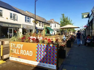 a sign that says enjoy a wall road on a street at Luxurious apartment just off Mill Rd, near station - walk to historic city centre in Cambridge