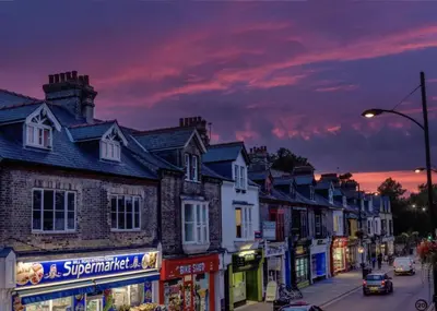 a row of houses on a city street at dusk at Luxury City CB1 Studio Just Off Mill Rd - Walk to Station and City Centre in Cambridge