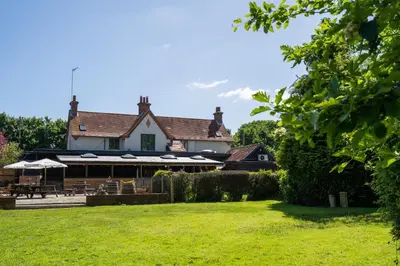 a house with a lawn in front of it at Kettleburgh Chequers in Kettleburgh