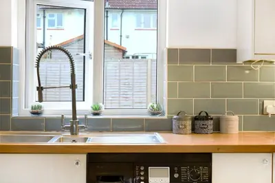 a kitchen counter with a sink and a window at Loughton 3 Bedroom Sleeps 5 by BSE Homes in Loughton