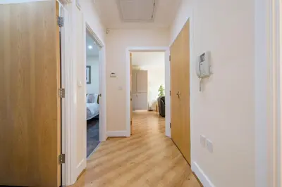 a hallway with a door leading to a bedroom at Camstay Longworth Avenue in Cambridge