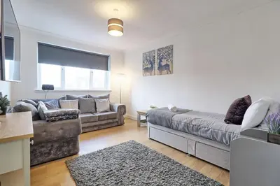 a living room with a couch at Lavish Rayleigh Apartment - LMV Property in Rayleigh