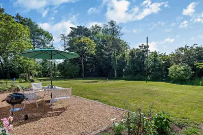 a picnic table and an umbrella in a park at 2 Bed in Ilketshall St. Margaret oc-w27520 in Rumburgh