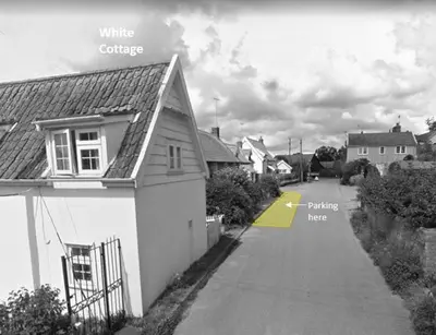 a black and white photo of a house and a street at 2 Bed in Sweffling oc-whcs in Rendham
