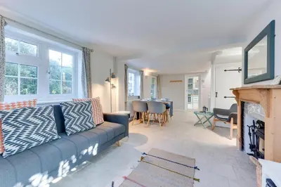 a living room with a couch and a fireplace at 2 Bed in Sweffling oc-whcs in Rendham