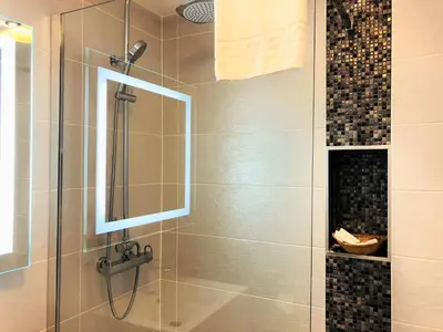 a bathroom with a shower with a glass door at Ilfracombe House Hotel - near Cliffs Pavilion in Southend-on-Sea