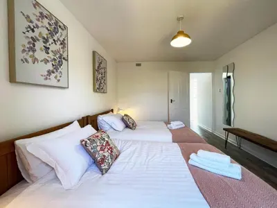 a bedroom with two beds with towels on them at Grace's Place in Ely in Ely