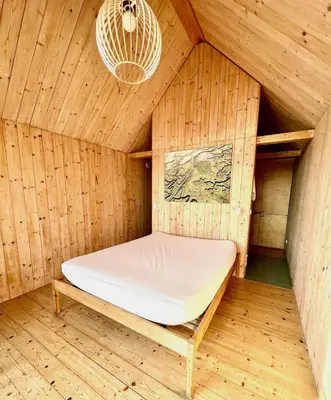 a sauna with a bed in a wooden room at Lushna 10 Classic Suite at Lee Wick Farm Cottages & Glamping in Clacton-on-Sea