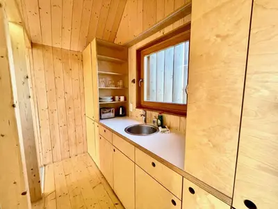 a small kitchen with a sink and a window at Lushna 10 Classic Suite at Lee Wick Farm Cottages & Glamping in Clacton-on-Sea